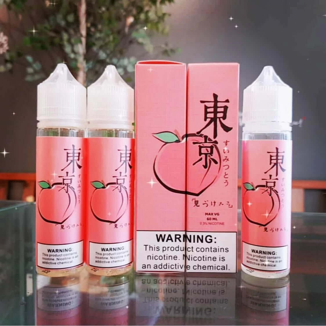 Tokyo peach e-liquid 60ml bottles and box closeup on table