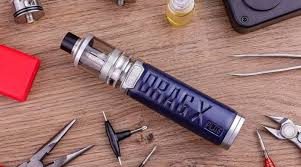 Voopoo Drag X Plus Professional blue mod on workbench with tools